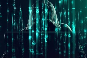 Hacker working showing employee databases data breach