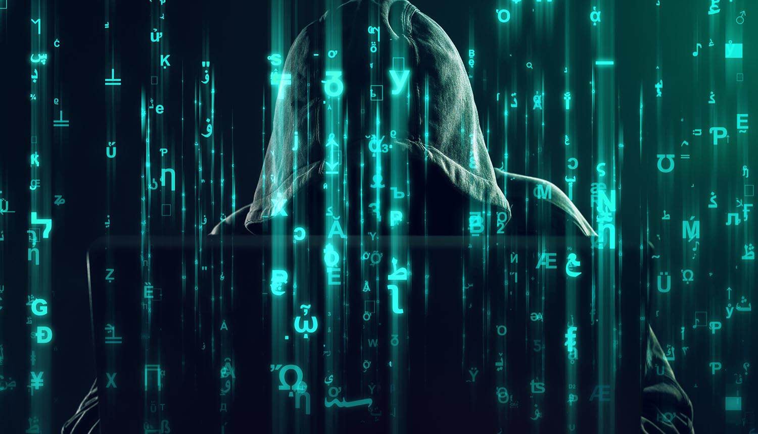 Hacker working showing employee databases data breach