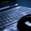 Hand on laptop showing LiteLLM supply chain attack