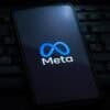 Meta logo on smartphone screen showing AI model hacking security vulnerability
