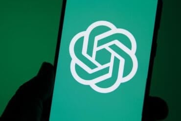 OpenAI logo on phone showing security safeguards for AI model