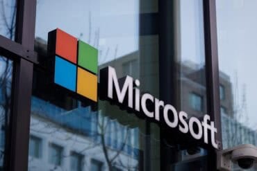Microsoft logo at office building showing Microsoft CoPilot AI assistant
