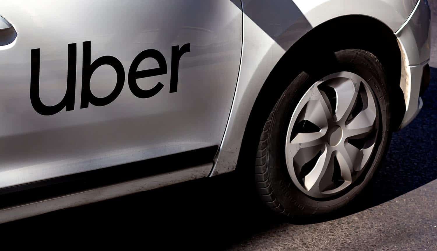 Uber logo branded car showing GDPR fine