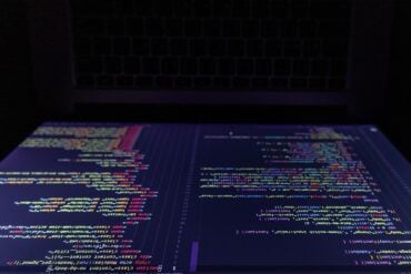 Screen of laptop showing AI agents cyber attack
