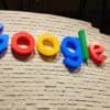 Google logo on a wall showing Gemini AI model