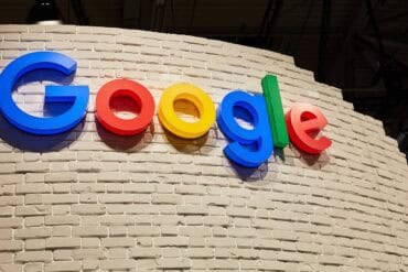 Google logo on a wall showing Gemini AI model