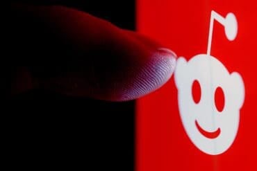 Finger on Reddit logo showing malware