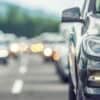 Traffic jam on the highway showing drivers' licences on dark web