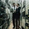 IT staff working in data center showing cyber resilience