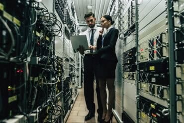 IT staff working in data center showing cyber resilience
