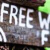 Wooden signboard about free wi-fi showing wi-fi flaw