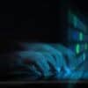 Hands on keyboard showing data breach at UK retailer