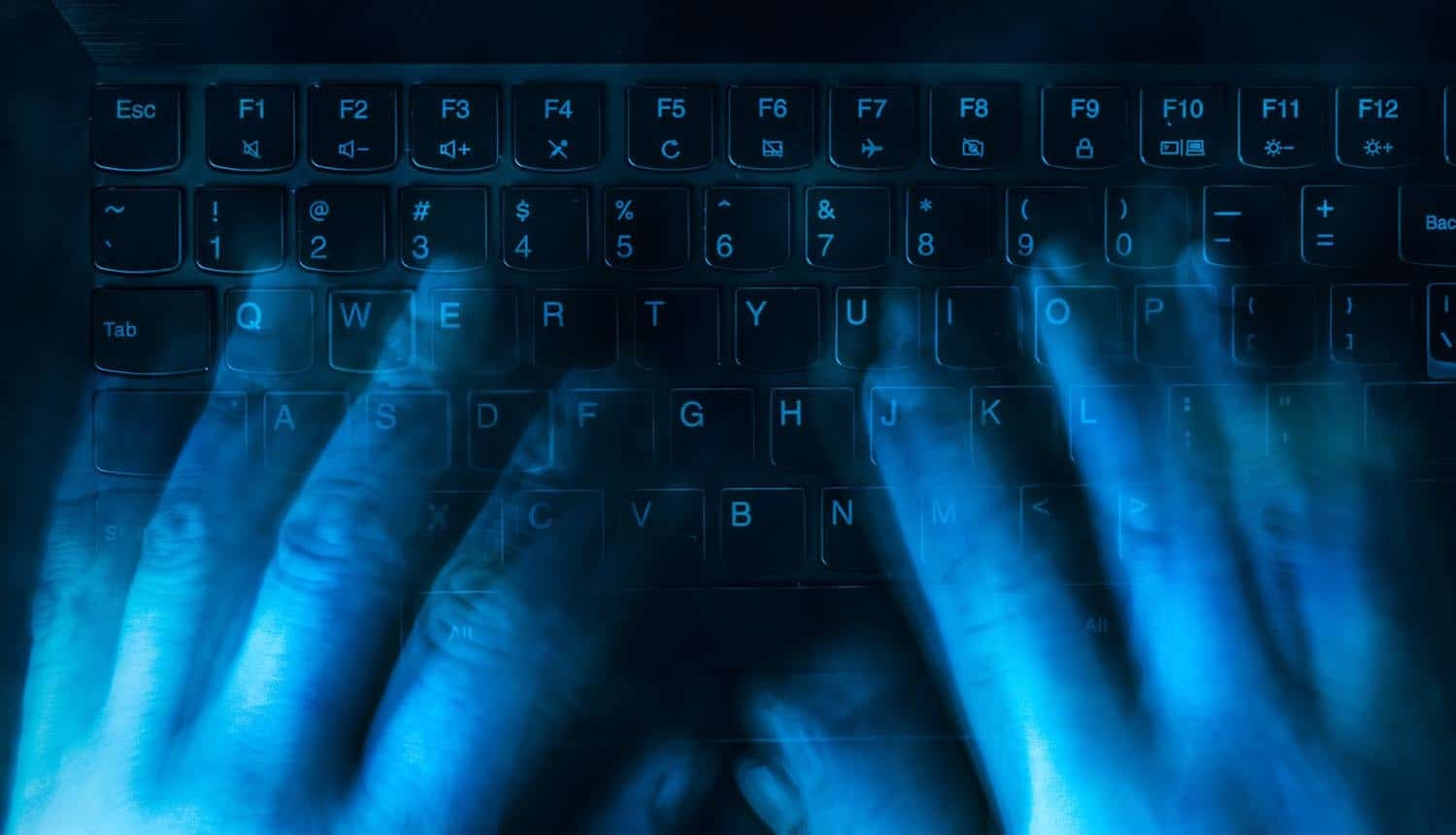 Hands on keyboard showing data breach