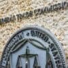 Federal Trade Commission seal on wall showing FTC investigation into AI safety