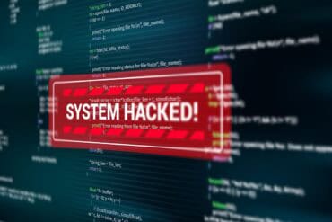 System hacked alert on screen showing AI incident response